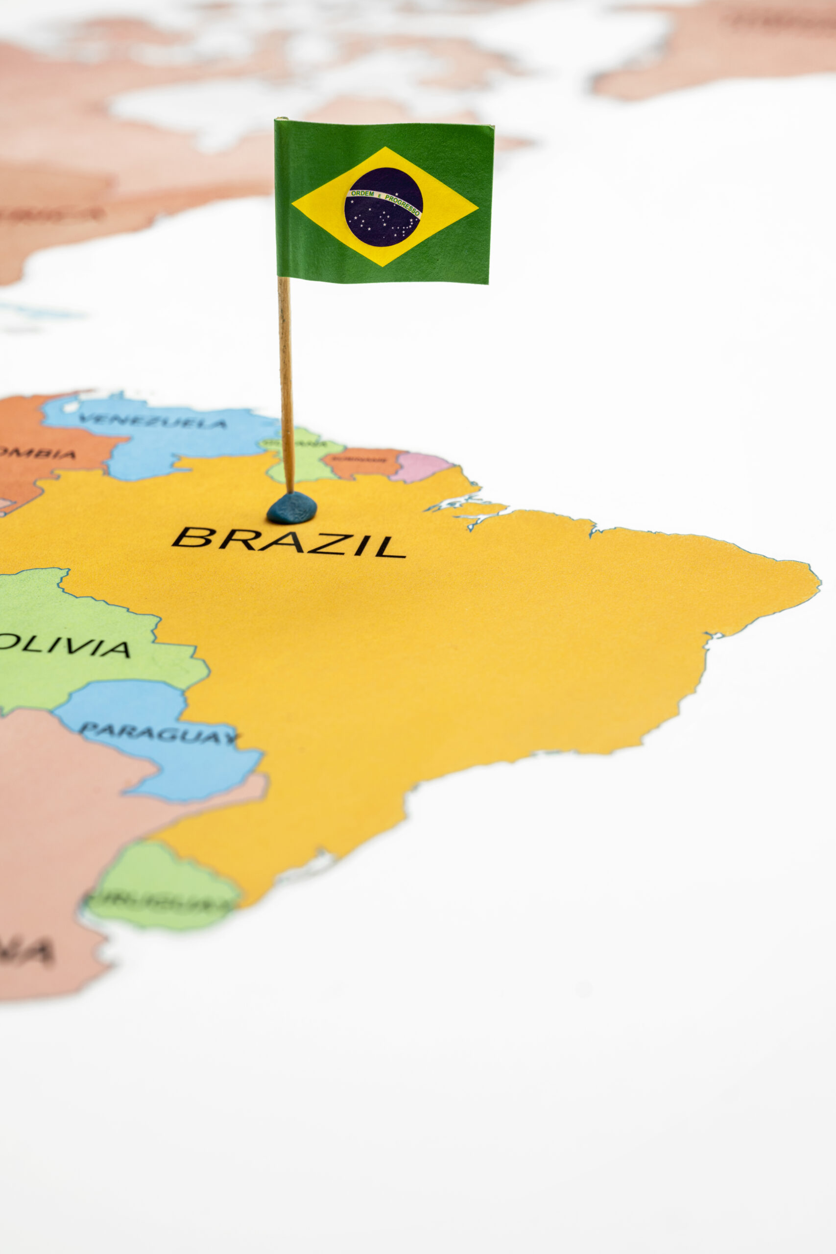A map of Brazil with a Brazilian flag on it. The flag is green. Travel and government concept
